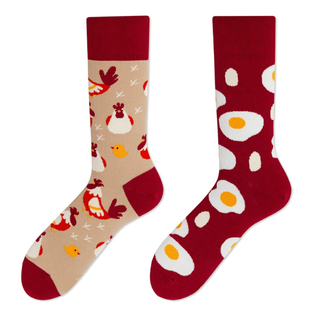 Mismatched socks with chicken and egg design – one sock with hens and chicks, the other with sunny-side-up eggs, unisex cotton socks