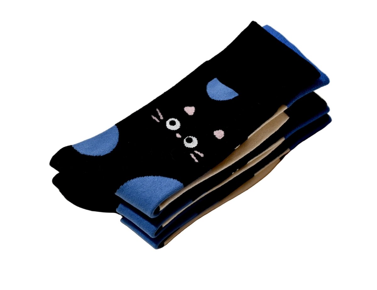Folded black socks with blue bubble and black cat face 
